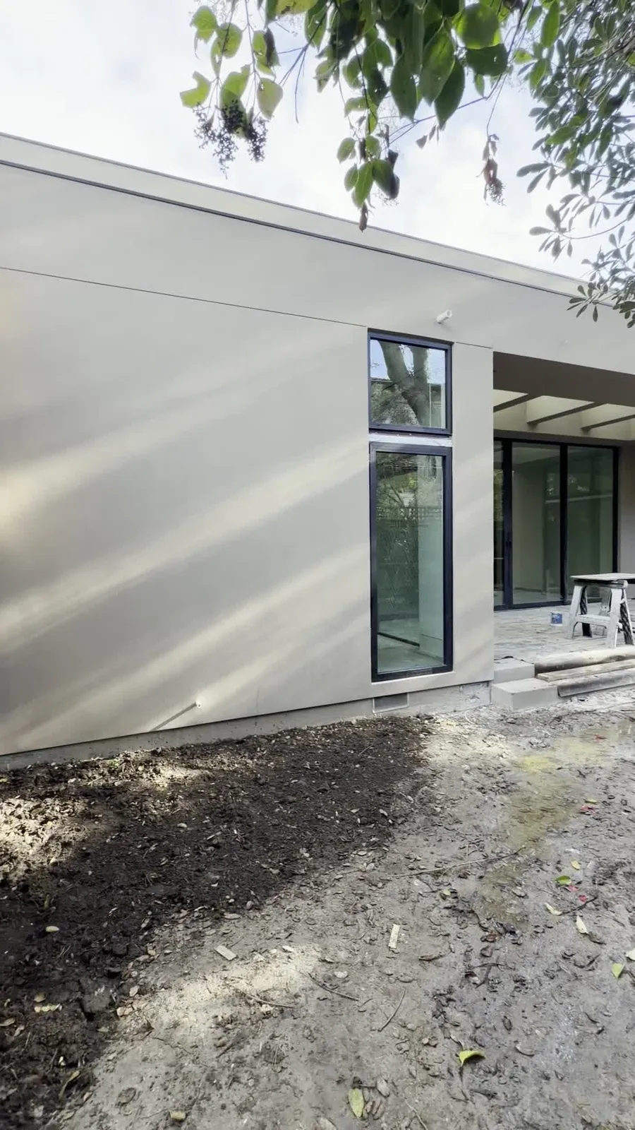 Smooth light stucco finish on a modern addition