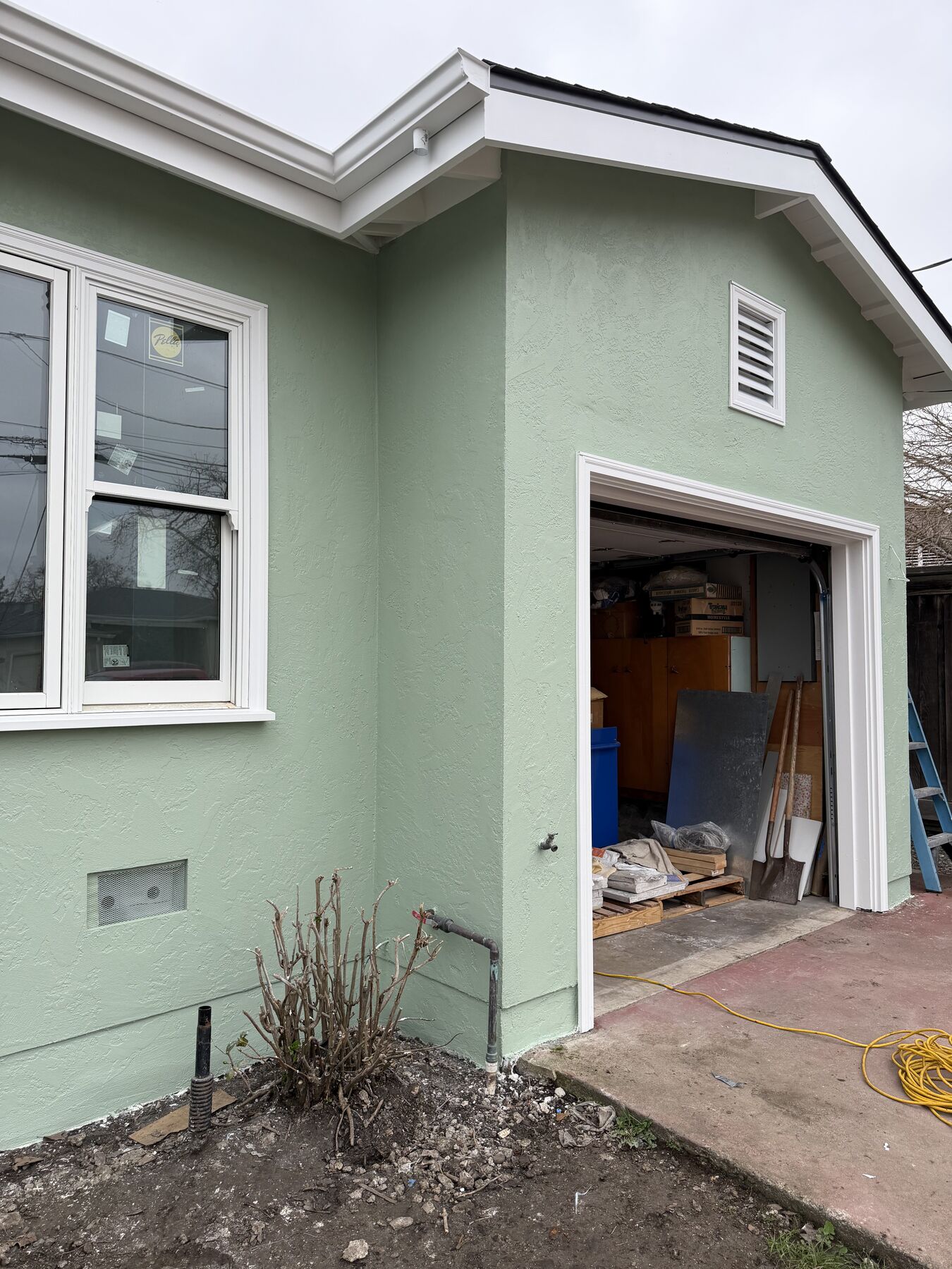 Stucco garage wing tied into the main house