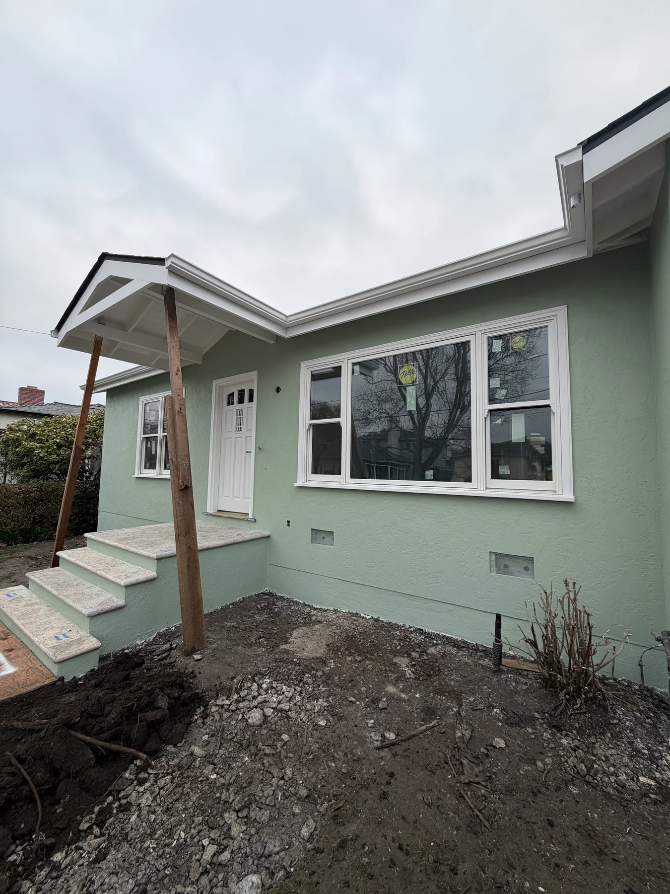 Completed textured stucco exterior on a detached garage in San Mateo