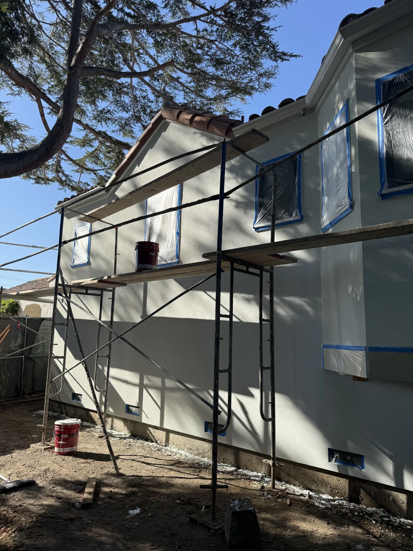 Scaffold in place during exterior stucco work in San Carlos